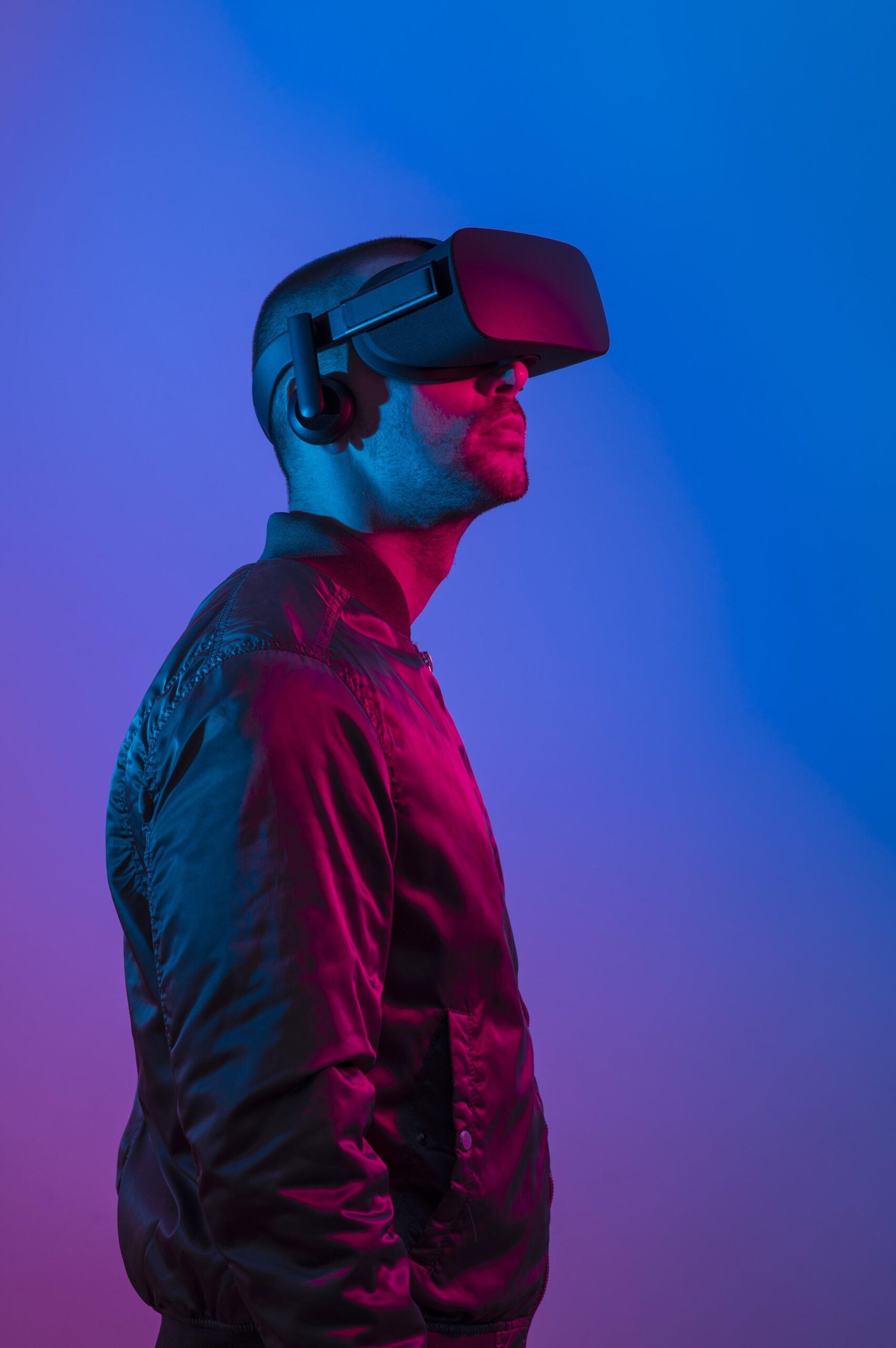 man-wearing-vr-glasses-with-blue-and-purple-light-scaled
